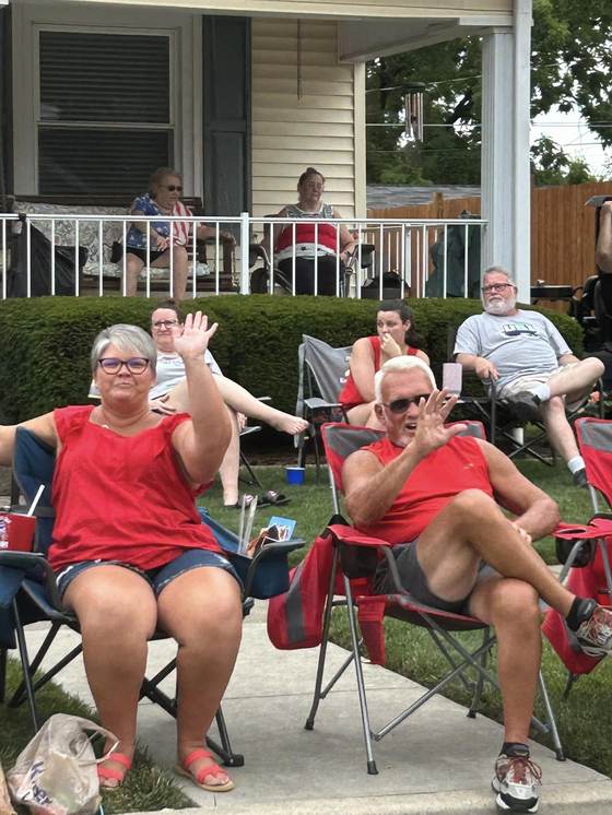 Neighbors watching the parade from the curb