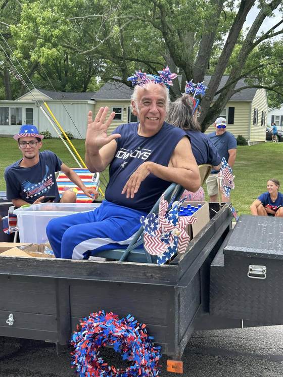 A wave from a parade float