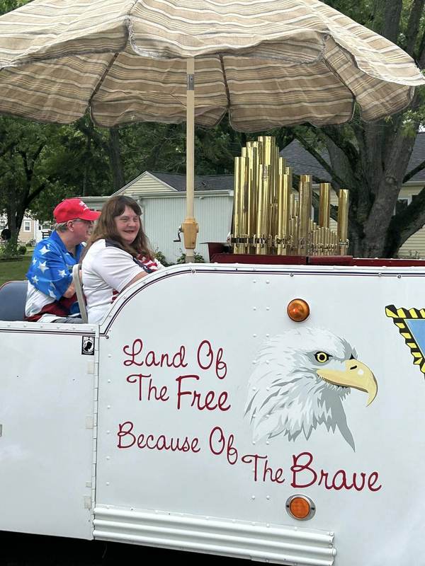 Calliope wagon reading Land of the Free Because of the Brave