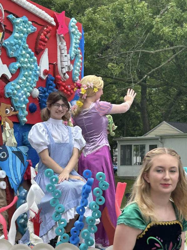 Under the sea themed parade float with costumed riders